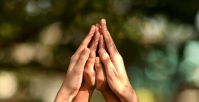 persons hand forming heart